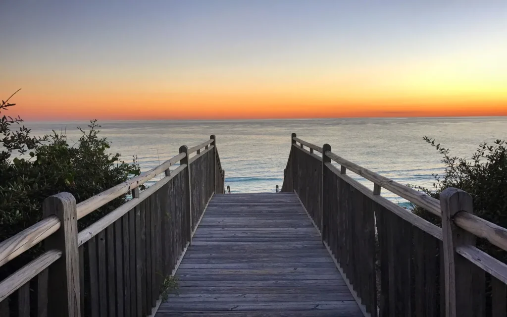 Wooden dune walkover leading to the Gulf at sunset in Alys Beach, on Scenic 30A, Florida